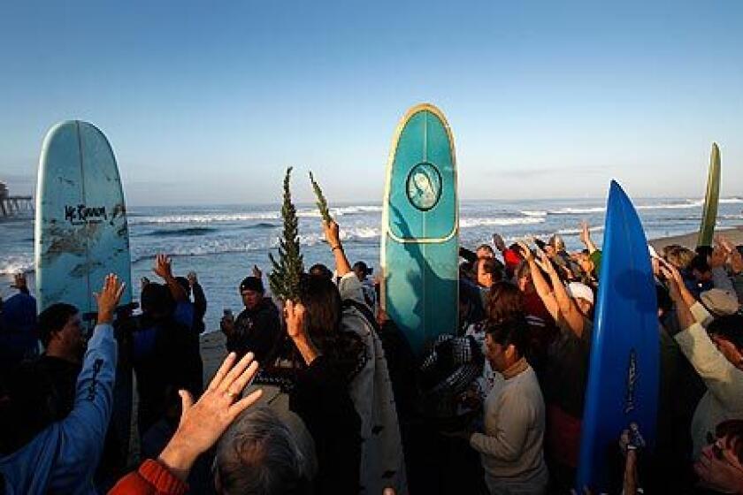 The faithful join a variety of spiritual leaders at the Huntington Beach Pier for a "blessing of the waves" service sponsored by the Roman Catholic Diocese of Orange. Amid sunny skies and a building ocean swell of 6- to 10-foot waves, the worshipers prayed for tubular surf and a safe return to shore. More photos >>>