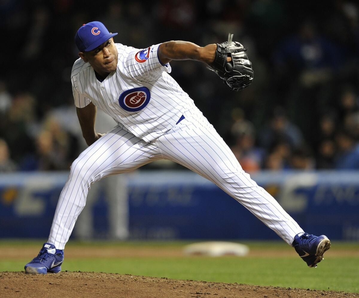 Carlos Marmol delivers a pitch against the Colorado Rockies on May 13.