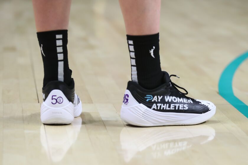LOS ANGELES, CA - JUNE 23: Los Angeles Sparks forward Katie Lou Samuelson #33 sneakers "Pay Women Athletes" during the Chicago Sky game versus the Los Angeles Sparks, on June 23, 2022, at Crypto.com Arena in Los Angeles, CA. (Photo by Jevone Moore/Icon Sportswire via Getty Images)