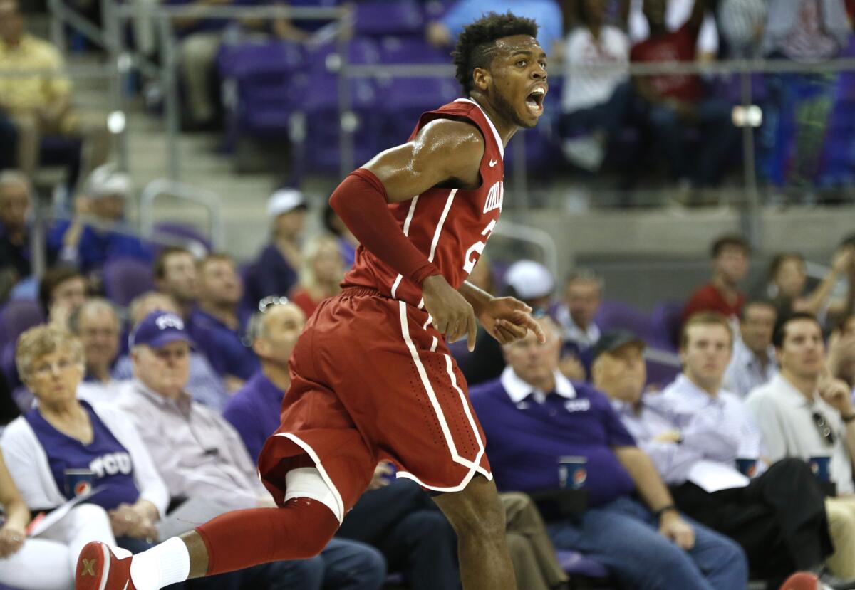 Oklahoma guard Buddy Hield reacts after scoring a basket during the first half of a game against TCU on March 5.