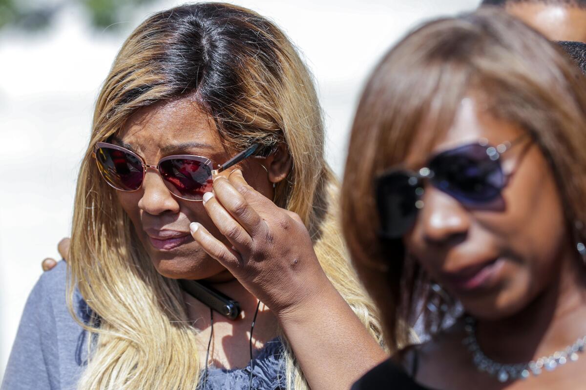 LaTisha Nixon, mother of Gemmel Moore, and Joann Campbell, sister of Timothy Dean.