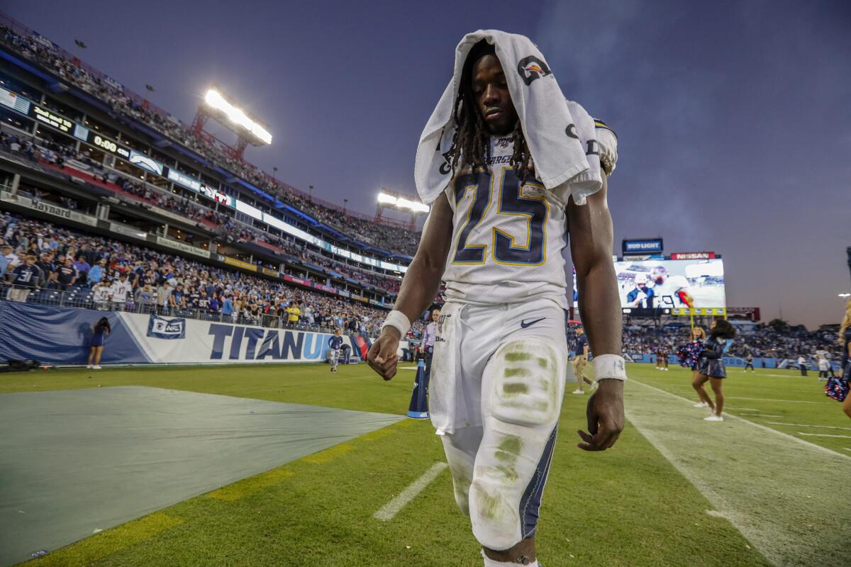 Chargers running back Melvin Gordon walks off the field following a loss to the Tennessee Titans.