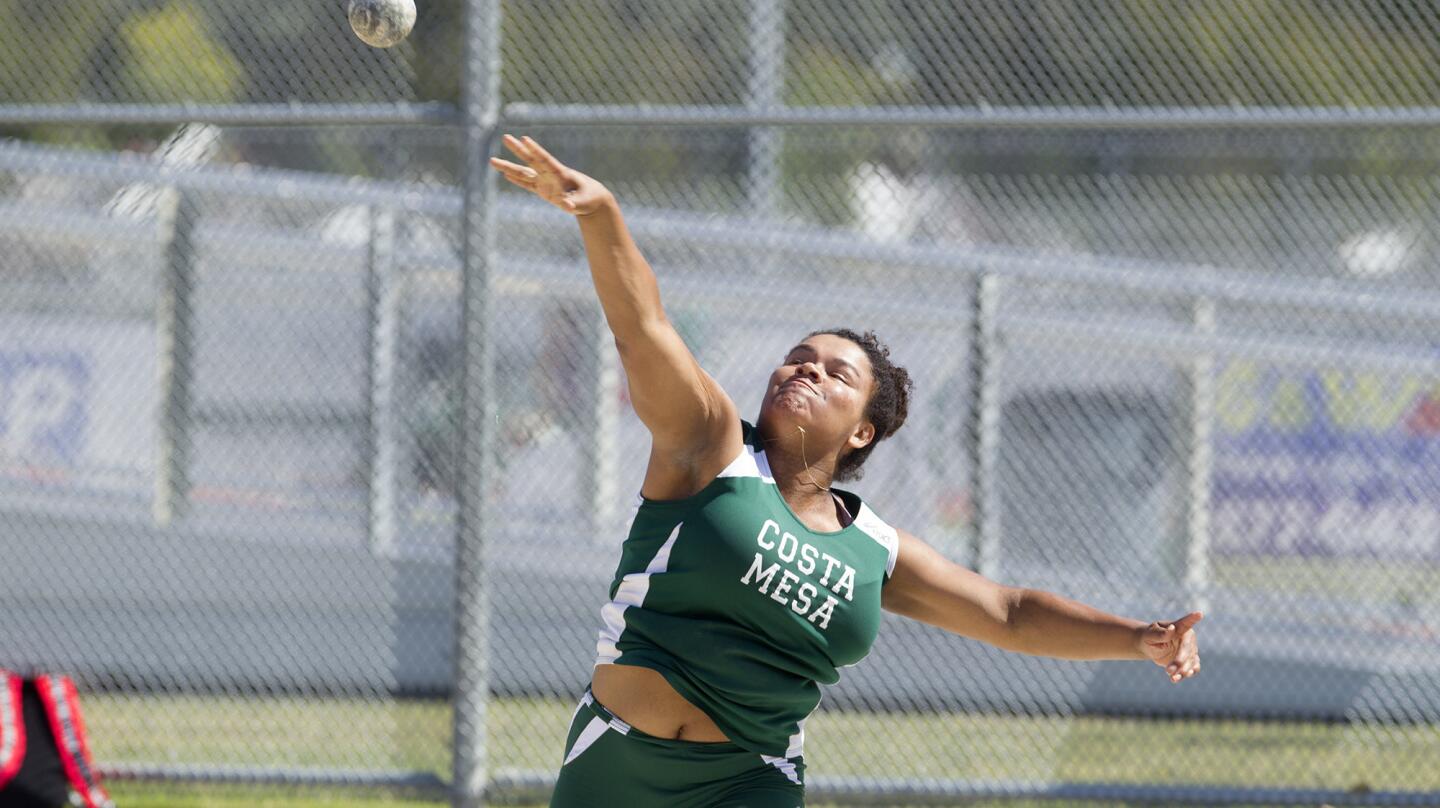 Costa Mesa High's Felicia Crenshaw competes in the girls' shot put during a track meet against Estancia and Saddleback on Thursday in Costa Mesa. (Kevin Chang/ Daily Pilot)