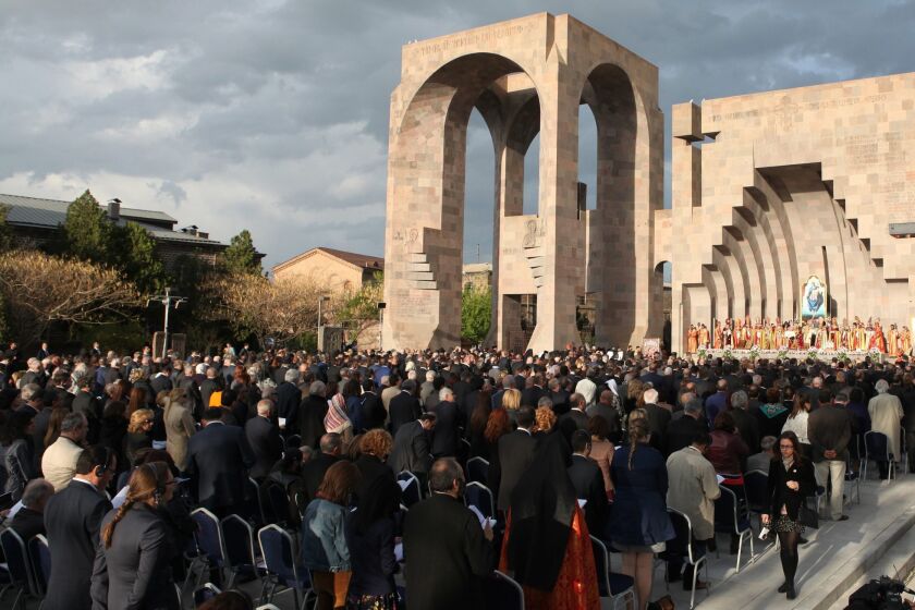 People attend a canonization ceremony for the victims of the Armenian Genocide at the Mother See of Holy Etchmiadzin complex outside Yerevan, Armenia, on April 23.