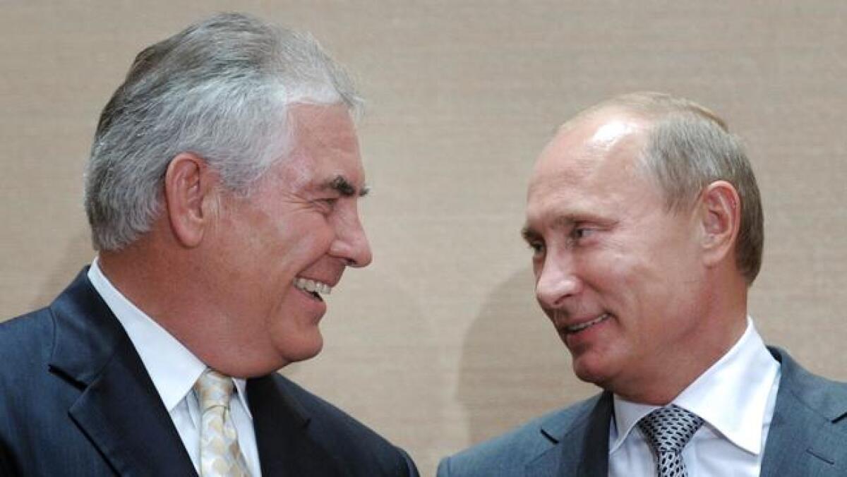 Russian Prime Minister Vladimir Putin, right, and then-Exxon Mobil Chief Executive Rex Tillerson meet in Sochi, Russia, on Aug. 30, 2011.