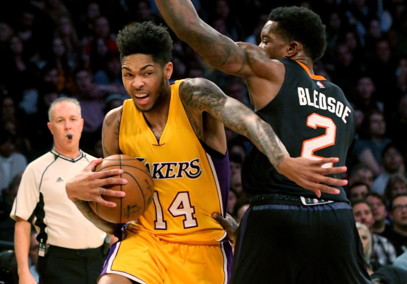 Lakers guard Brandon Ingram drives to the basket against Suns guard Eric Bledsoe in the fourth quarter.