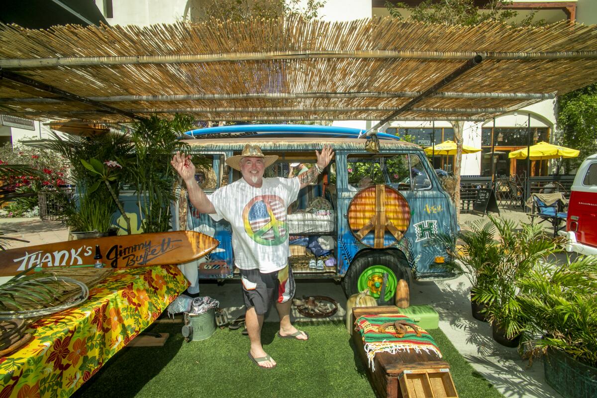 Hank H. Hitchcock enjoys his 1970 VW bus "Tiki" with Jimmy Buffett music playing in the background.