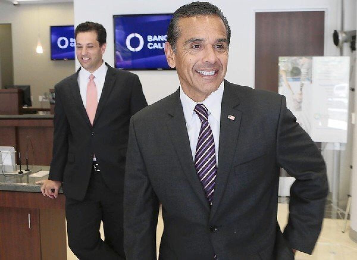 Antonio Villaraigosa and Banc of California CEO Steven Sugarman, left, are shown on Tuesday. Villaraigosa said he was intrigued by the opportunity to figure out how to provide greater access to home loans in communities hit hard by the recession.