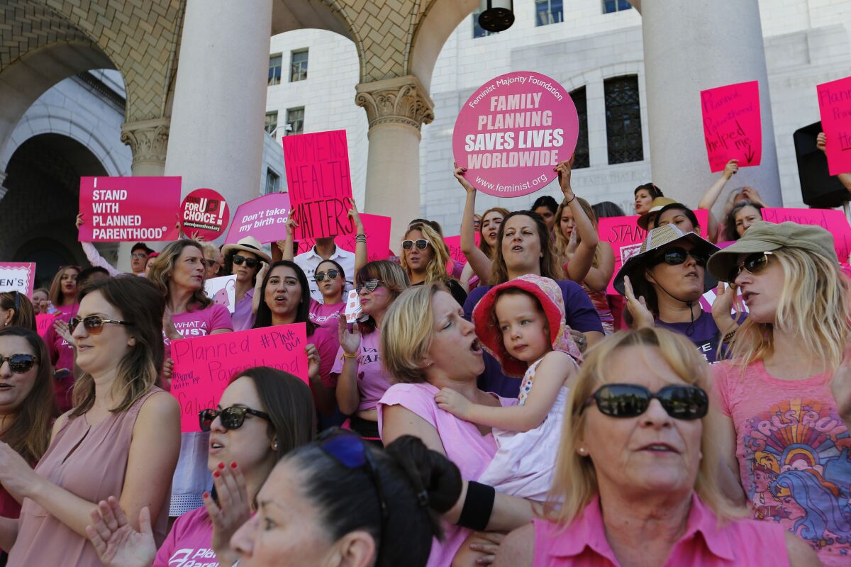 Planned Parenthood supporters, staff and volunteers rally at the Los Angeles City Hall in September to speak out for women's access to reproductive healthcare.