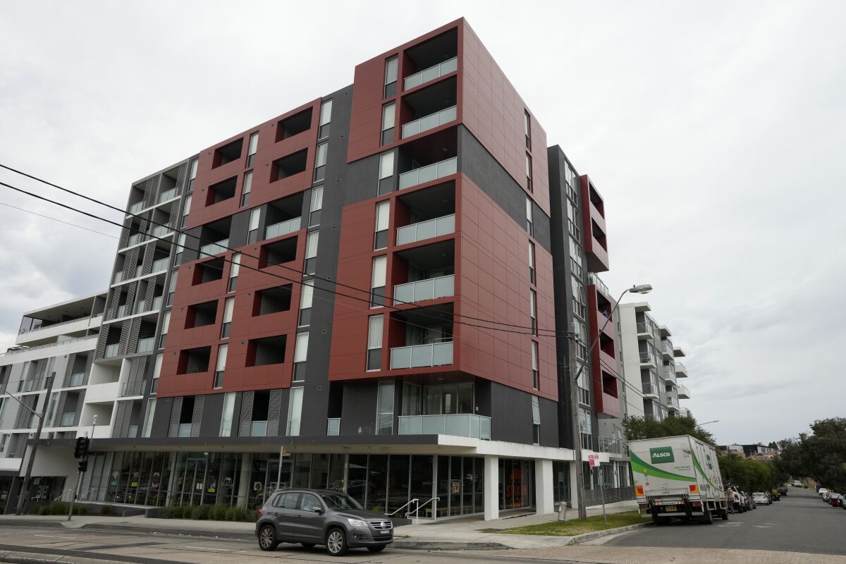 An apartment building stands on a corner in a Sydney suburb on Thursday, Aug. 4, 2022. The Sydney apartment where the bodies of two Saudi sisters were found in June is back on the rental market with a real estate ad advising their deaths were "not a random crime and will not be a potential risk for the community." (AP Photo/Rick Rycroft)