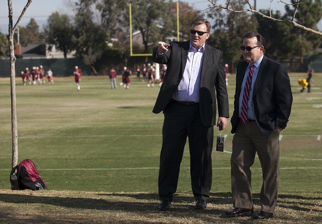Mayor Pro Tem Steve Mensinger, left, and Mayor Jim Righeimer watch Florida State practice at the Jack Hammett Sports Complex in Costa Mesa on Friday.