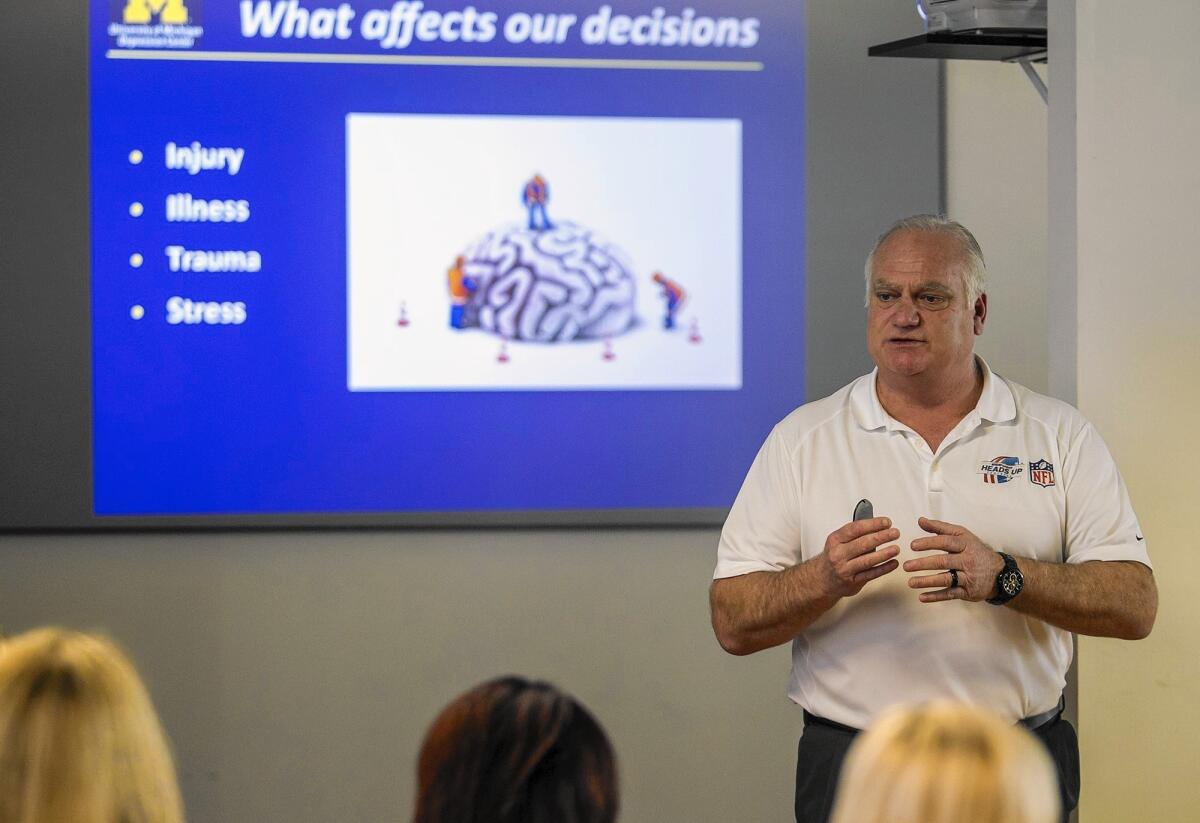 Former Detroit Lions quarterback Eric Hipple leads a discussion at Simple Recovery in Costa Mesa on Thursday. Hipple’s son Jeff committed suicide in 2000, leading the ex-NFL player to learn more about how depression affects student athletes.