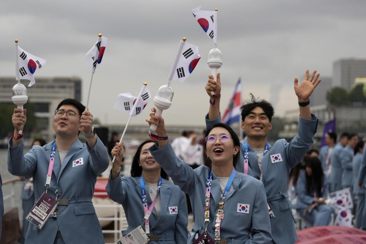 Members of South Korea's Olympic team cheer during the Paris Games opening ceremony Friday.