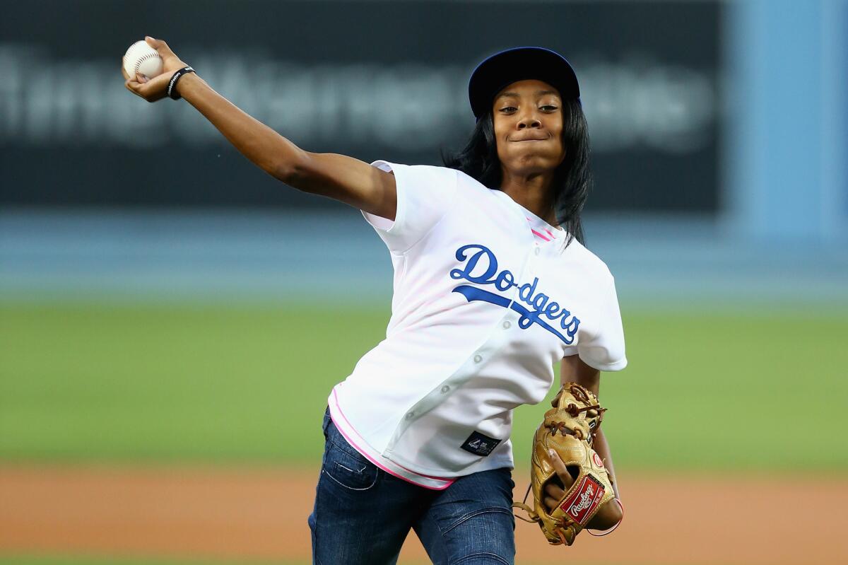 Little League World Series star pitcher Mo'ne Davis throws out the ceremonial first pitch Tuesday at Dodger Stadium.