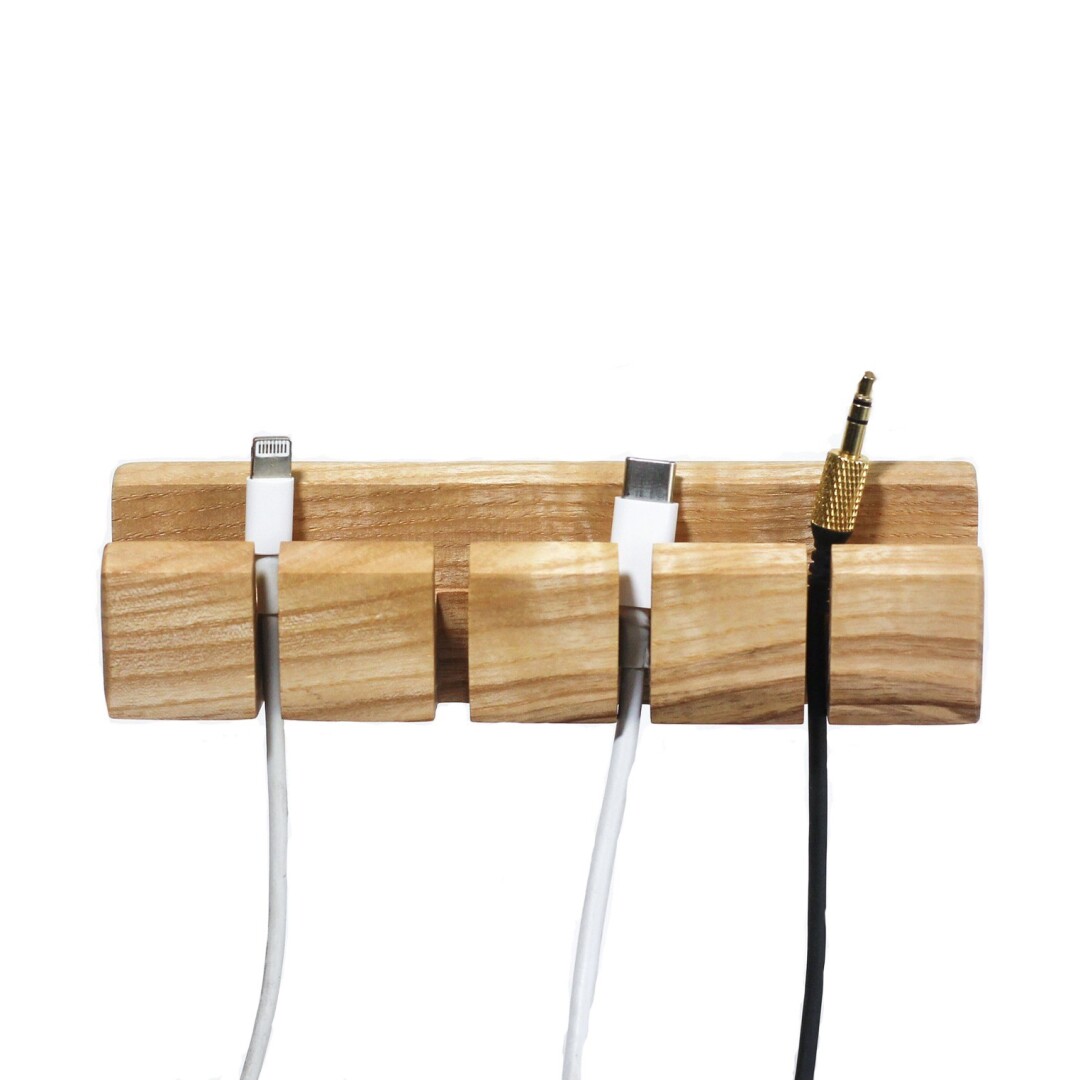 Cables separated by a wooden organizer