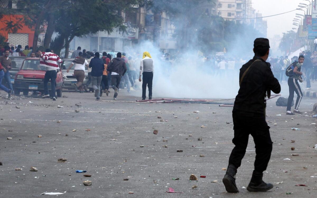 Egyptian security forces fire tear gas at supporters of ousted president Mohamed Morsi during clashes in the Nasr City district of Cairo.