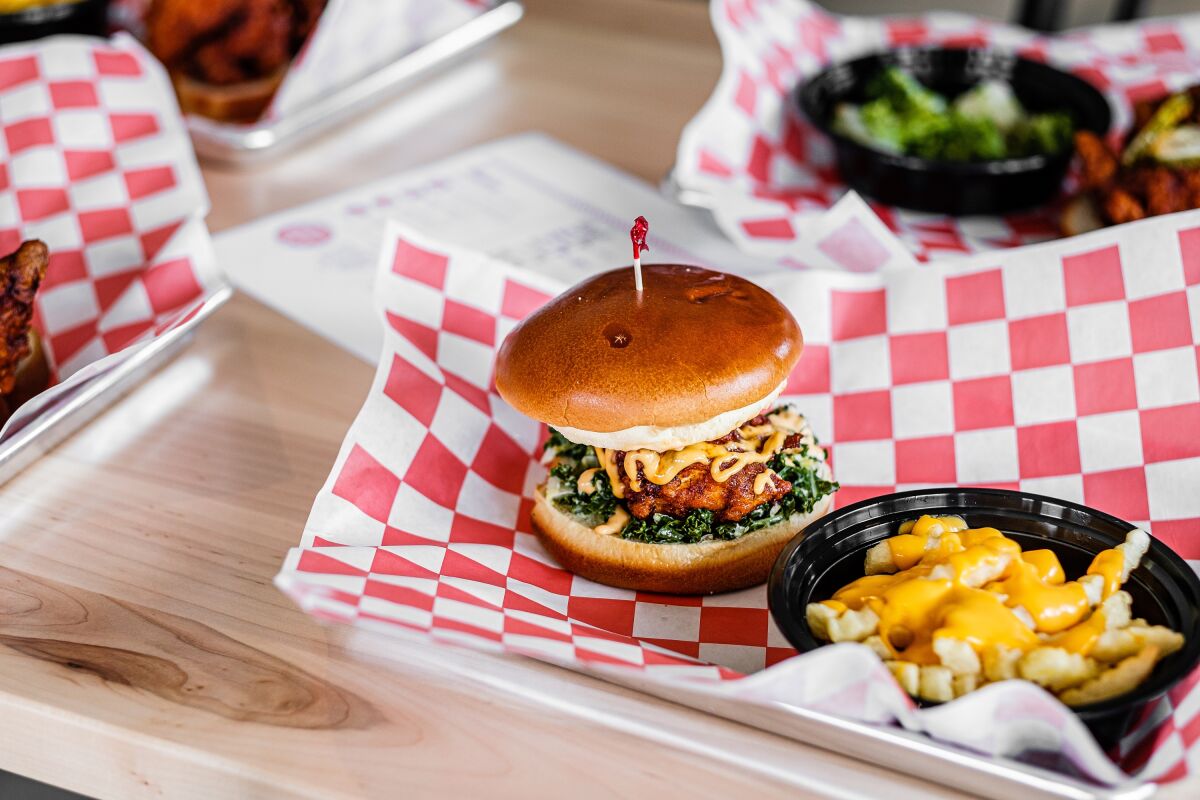 The Corner Chicken Sando, made with Nashville-style hot chicken, kale slaw, pickles and signature sauce.