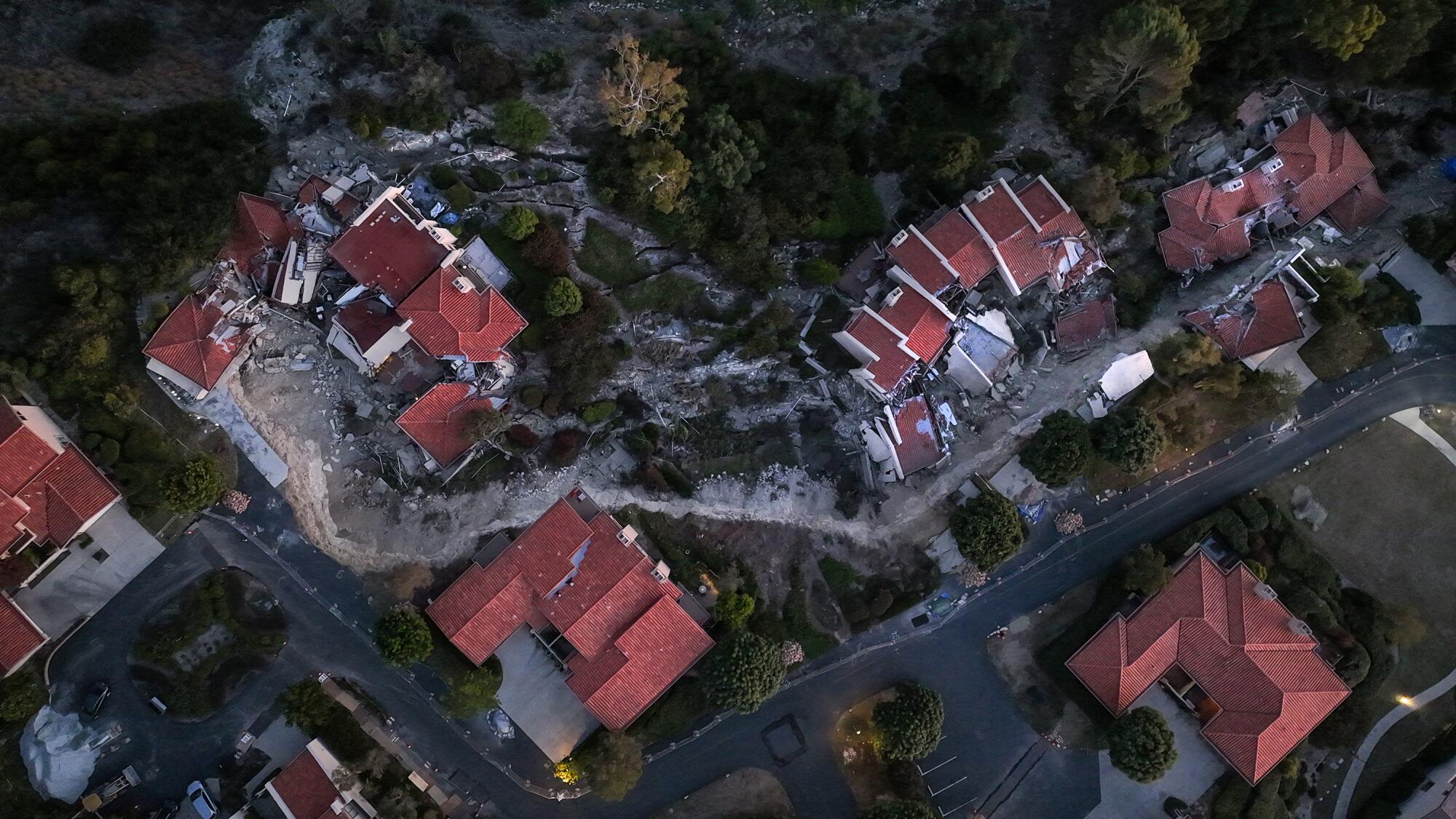 An aerial view shows damaged homes on Peartree Lane in Rolling Hills Estates.