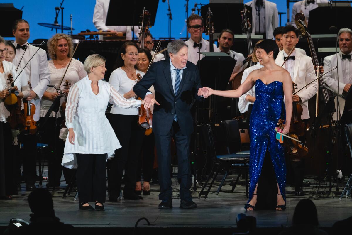Karen Kamensek, Philip Glass, and Anne Akiko Meyers this past fall at the Hollywood Bowl.