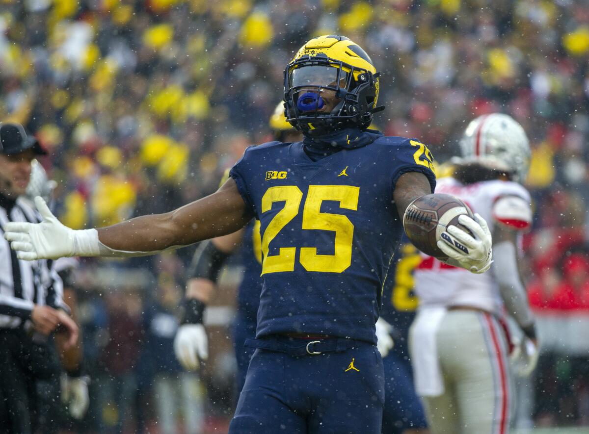 Michigan running back Hassan Haskins celebrates a touchdown in the fourth quarter against Ohio State.
