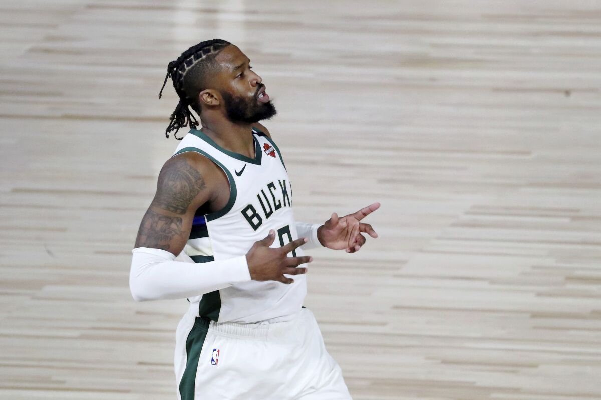 Wesley Matthews, playing for Milwaukee, retreats on defense after making a three-pointer against Orlando during the playoffs.