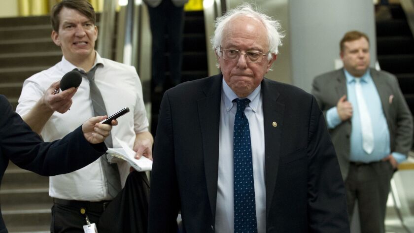 Sen. Bernie Sanders (I-Vt.) heads to his office on Dec. 21.