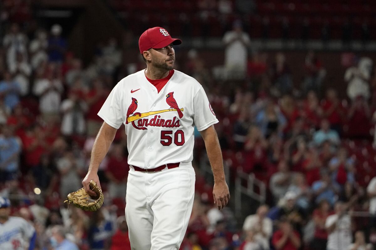 St. Louis Cardinals starting pitcher Adam Wainwright walks off the field after being removed during the ninth inning of a baseball game Wednesday, Sept. 8, 2021, in St. Louis. (AP Photo/Jeff Roberson)