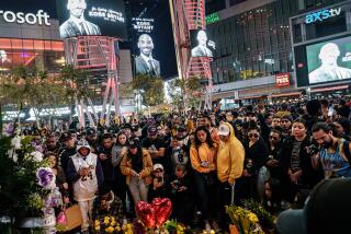 LOS ANGELES, CALIF. -- SUNDAY, JANUARY 26, 2020: Fans gather outside the Staples center to mourn the death of Kobe Bryant after news spread of Kobe Bryant and his daughter Gianna are among 9 dead in helicopter crash in Calabasas that morning, in Los Angeles, Calif., on Jan. 26, 2020. (Marcus Yam / Los Angeles Times)