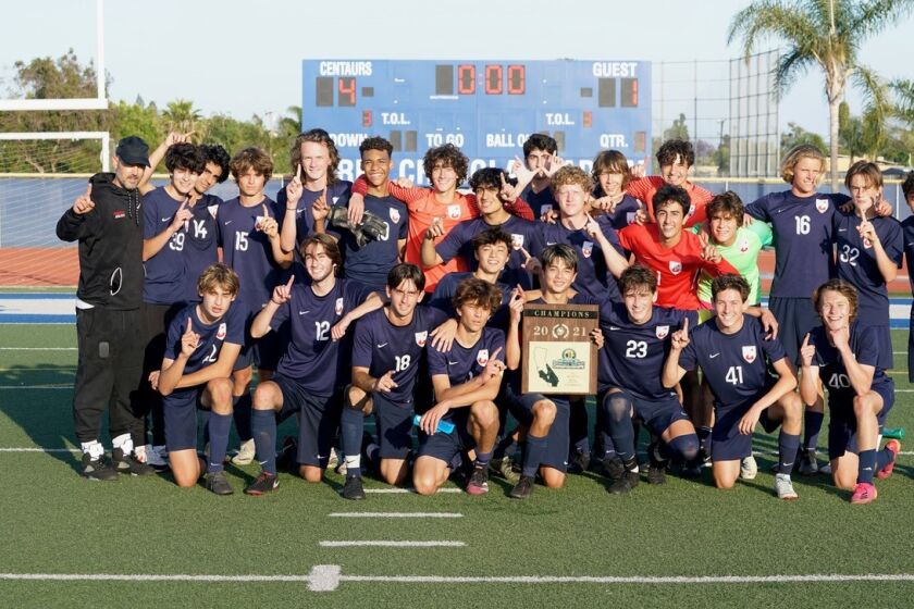 Crossroads soccer team celebrates Division 5 regional and section titles.