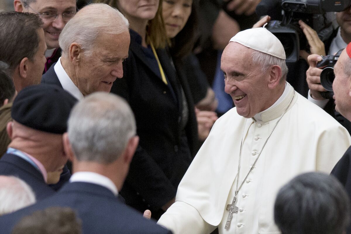 FILE - In this April 29, 2016, file photo Pope Francis shakes hands with Vice President Joe Biden as he takes part in a congress on the progress of regenerative medicine and its cultural impact, being held in the Pope Paul VI hall at the Vatican. President Joe Biden is set to meet Pope Francis when he visits the Vatican later this month as part of a five-day swing through Italy and the U.K. for global economic and climate change meetings. (AP Photo/Andrew Medichini, File)