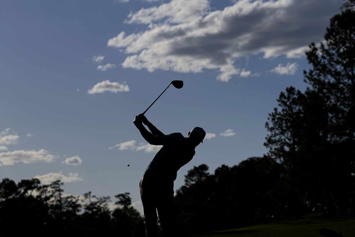 Dustin Johnson tees off on the 15th hole during the first round of the Masters on Thursday.
