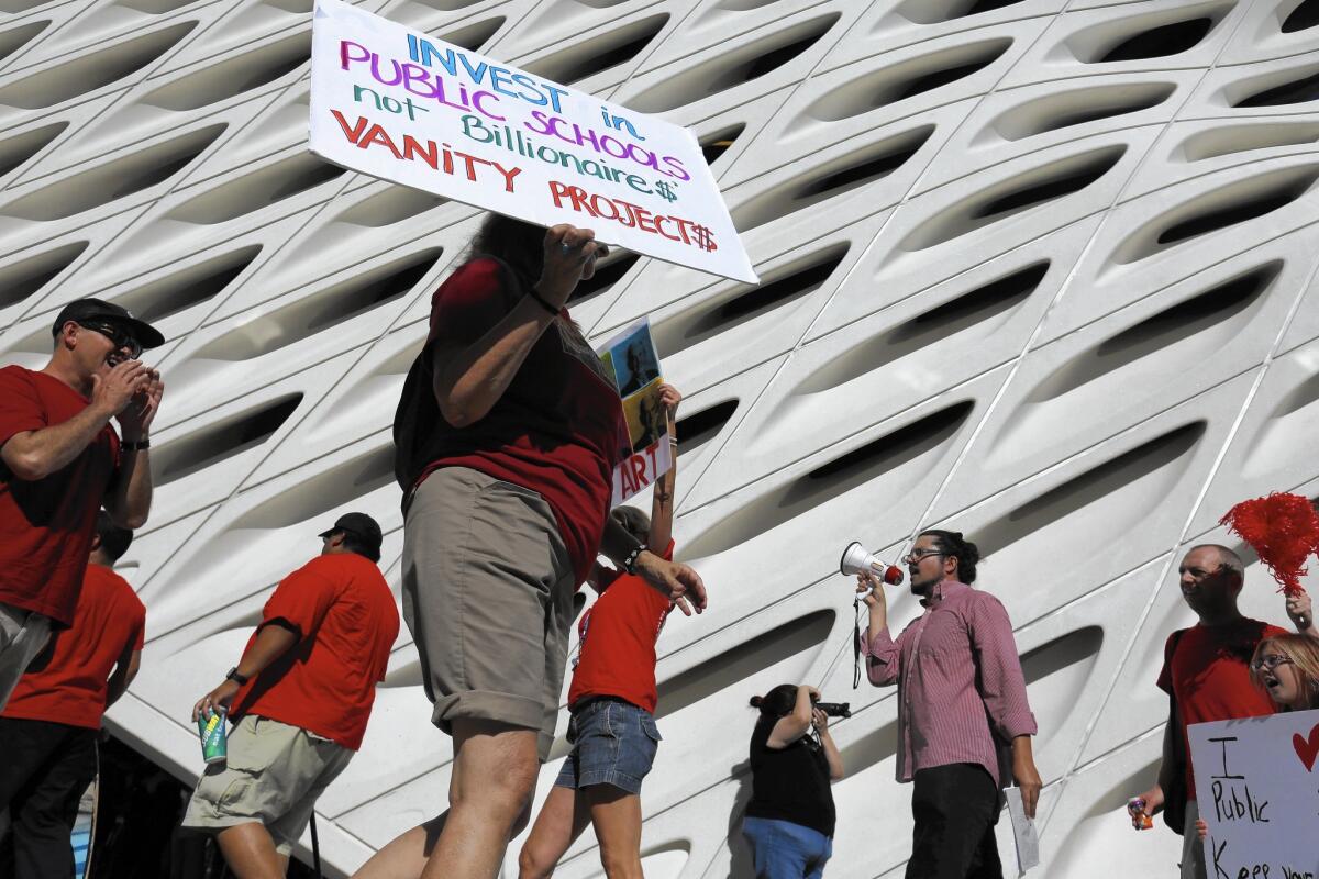 Members of the United Teachers Los Angeles union protest last month on the opening day of the Broad, a new L.A. art museum. The Eli and Edythe Broad Foundation is spearheading a $490-million plan to open 260 new charter schools in L.A. in eight years.