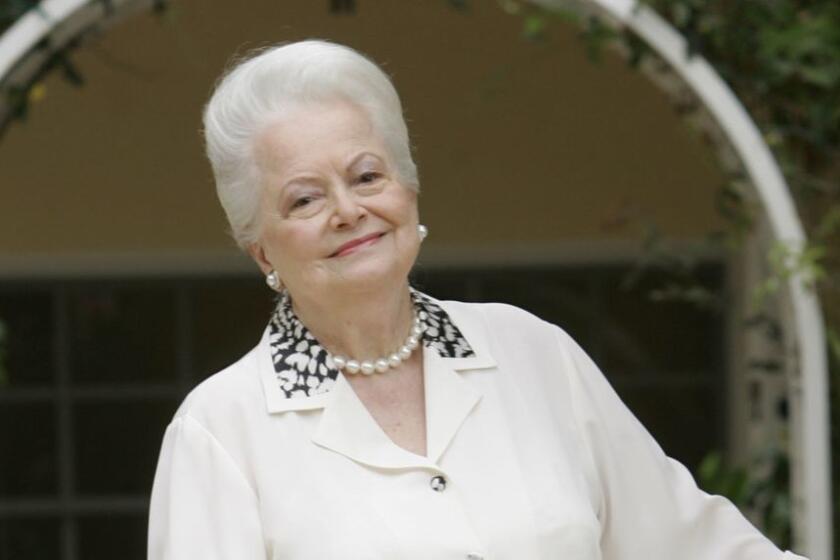Legendary actress Olivia de Havilland, the last surviving star of "Gone with the Wind," and two-time winner of the Oscar as best actress, poses for a photo Thursday, June 8, 2006, in Malibu, Calif. De Havilland will receive a rare "tribute" from the Academy of Motion Picture Arts and Sciences on June 15, that will feature film clips of her long career, accompanied by her own remembrances. (AP Photo/Reed Saxon) ORG XMIT: LA107