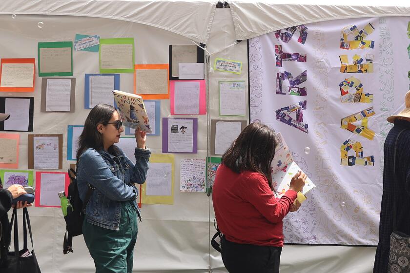 Los Angeles, CA - April 19: People wait in line during the LA Times Book Festival at USC campus on Friday, April 19, 2024 in Los Angeles, CA. (Michael Blackshire / Los Angeles Times)