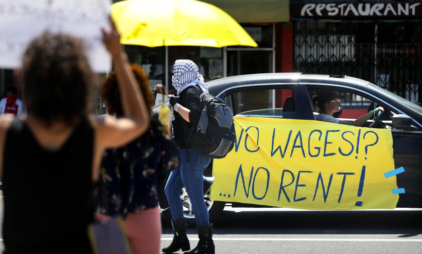 Members of the Los Angeles Tenants Union and their supporters hold a demonstration April 1 at Mariachi Plaza in Boyle Heights to demand rent forgiveness due to the coronavirus economic crisis.