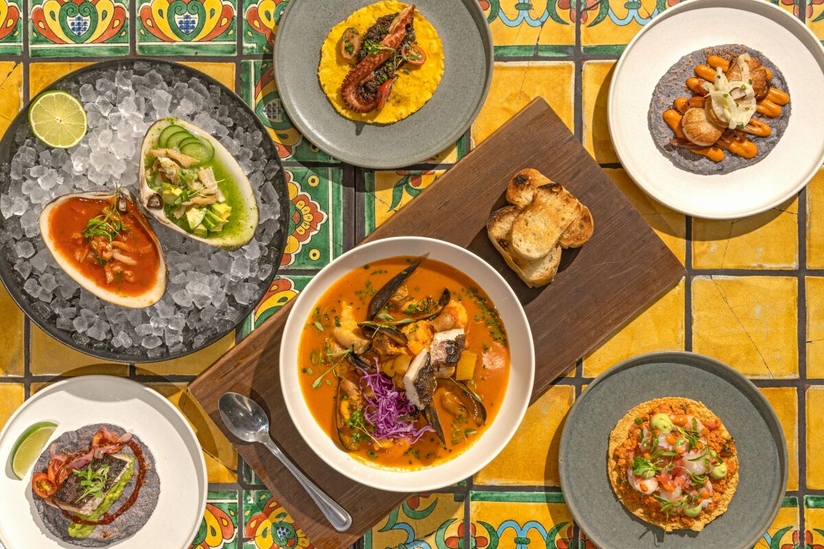 From left to right: grilled taco, almeja preparada, octopus taco, smoked kanpachi tostada and seafood stew at Holbox.