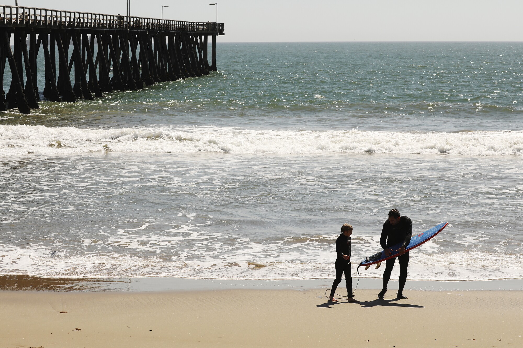 Brian Ledis of Westlake Village with son Rowan on the beach in Port Hueneme.