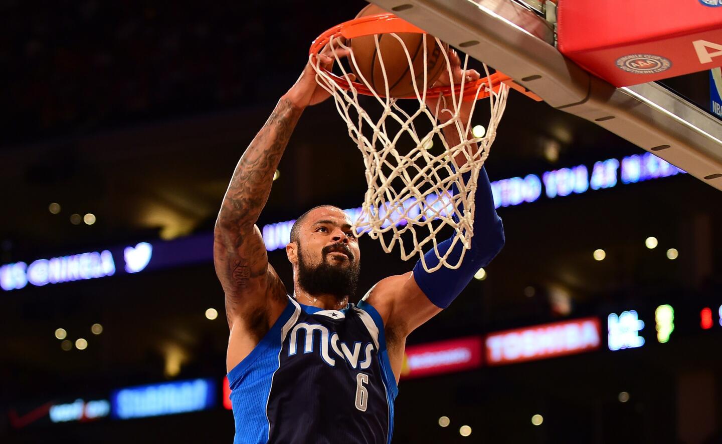 Mavericks center Tyson Chandler throws down a slam dunk in Dallas' 100-93 win over the Lakers.