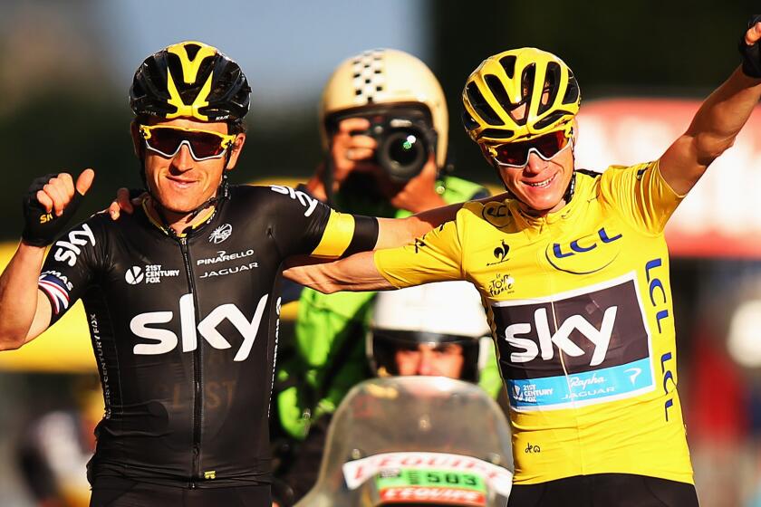 Tour de France winner Chris Froome, right, celebrates with Team Sky teammate Geraint Thomas at the end of the final stage of the race in Paris on Sunday.