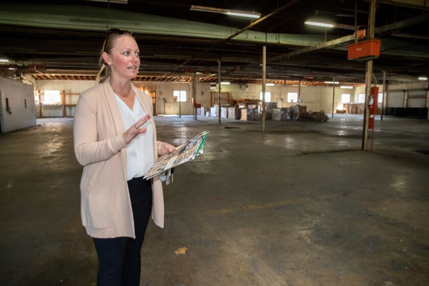 Escondido, CA - September 23: Jennifer Schoeneck, Deputy Director of Economic Development Economic Development for the City of Escondido, tours the former mattress factory and warehouse now owned by the city, where there is a proposal to convert the property into an agricultural and technology incubator. The property sits on 3.5 acres and has 40,000 square feet of industrial space. Friday, Sept. 23, 2022 in Escondido, CA. (Don Boomer / For The San Diego Union-Tribune)