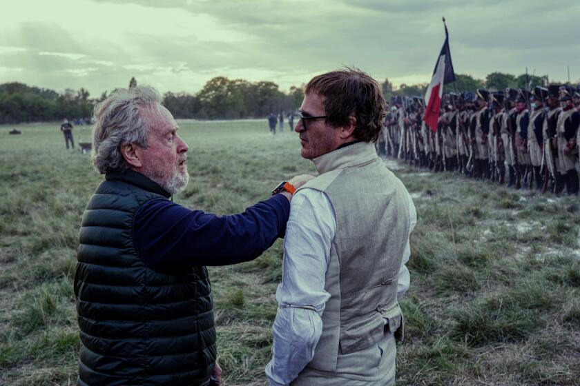 FOR THE ENVELOPE 2023 - DO NOT USE ELSEWHERE. Director Ridley Scott and Joaquin Phoenix behind-the-scenes of "Napoleon," premiering in theaters around the world on November 22, 2023.