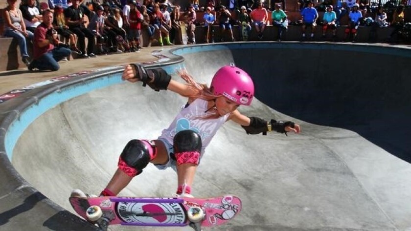 Bella Kenworthy, 8, of Dana Point, competes in the under-14 division of the bowl competition Saturday during the 2015 Exposure female skateboarding event at Encinitas Community Park.