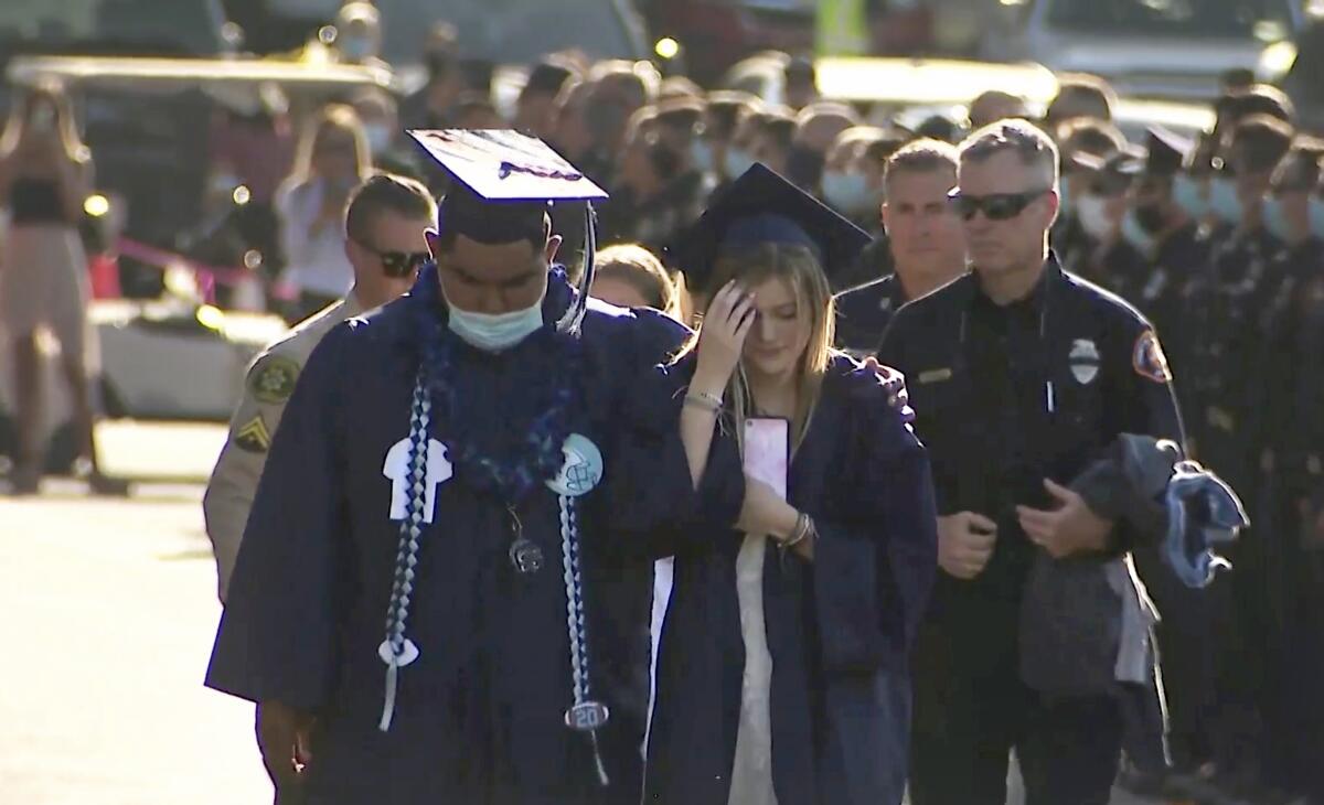 Firefighters from across California turned out to support the daughter of Tory Carlon as she graduated from high school. 