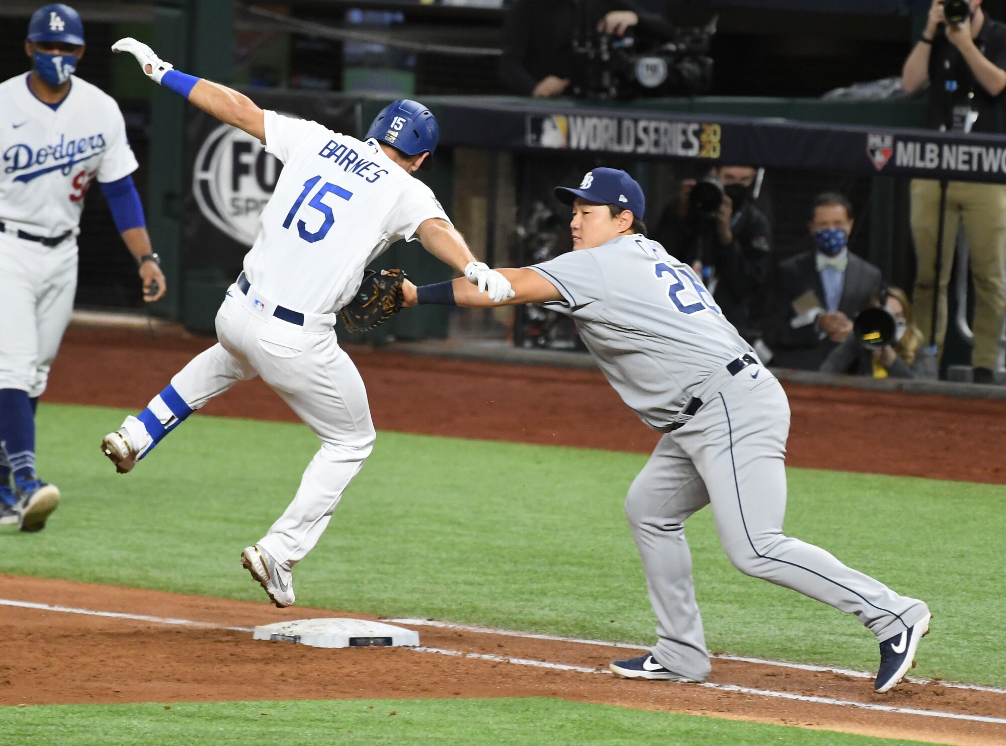 Rays first baseman Ji-Man Choi tags out a leaping Austin Barnes.
