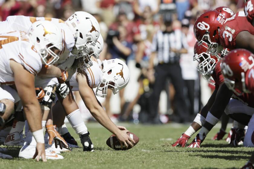 Oklahoma and Texas line up for play during the second half of the Red River Rivalry on Oct. 8.