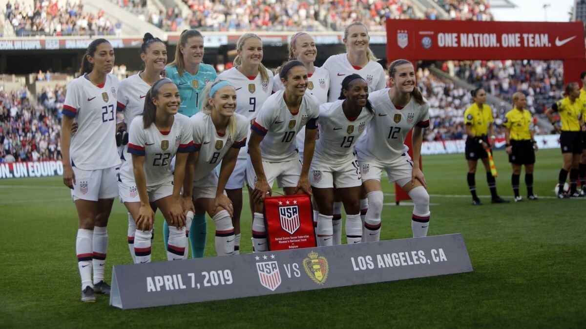 Members of of the U.S. women's national soccer team pose before the start of their game against Belgium at Banc of California Stadium on April 7.