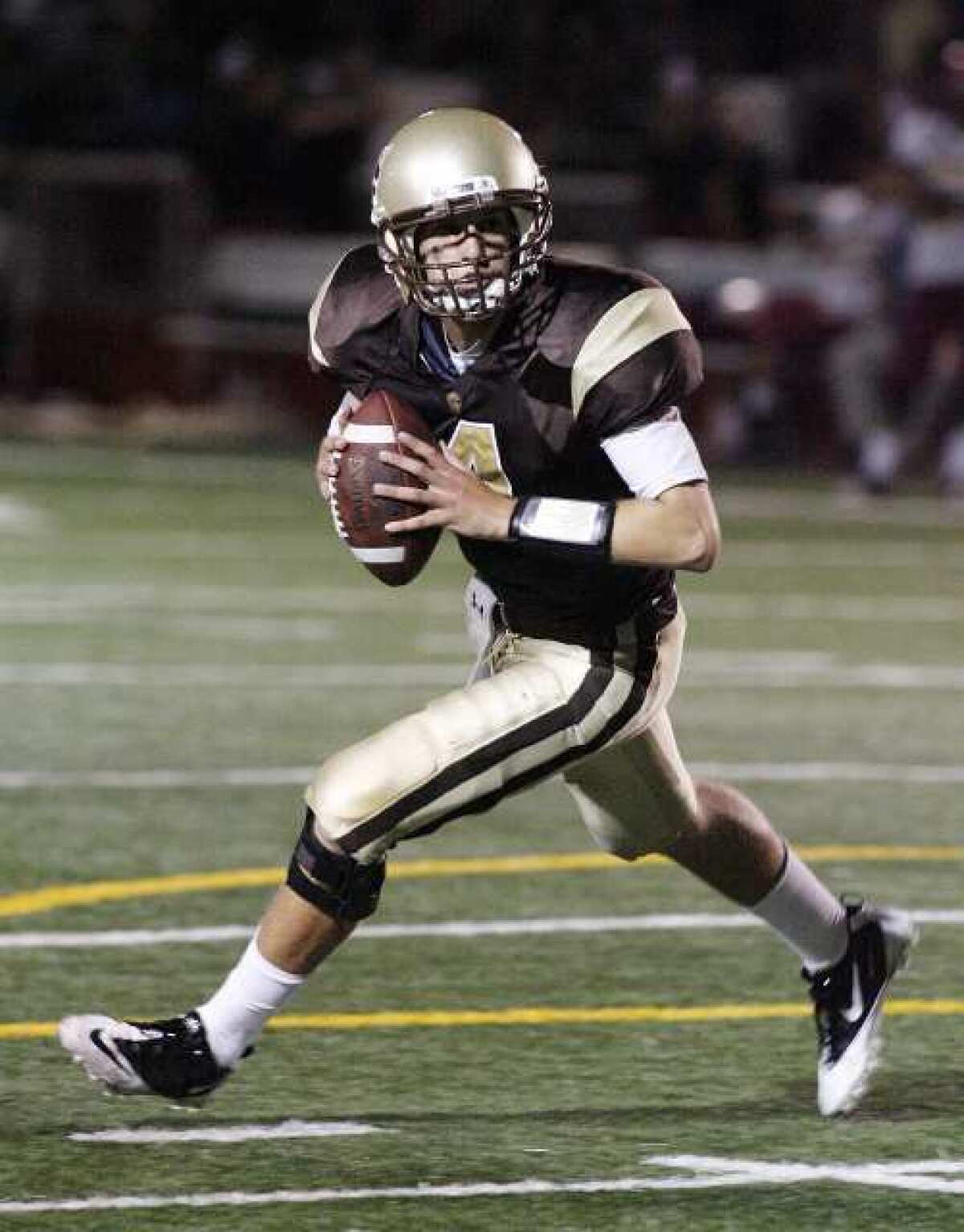 ARCHIVE PHOTO: St. Francis quarterback Jared Lebowitz rolls out to find a receiver against Arcadia.