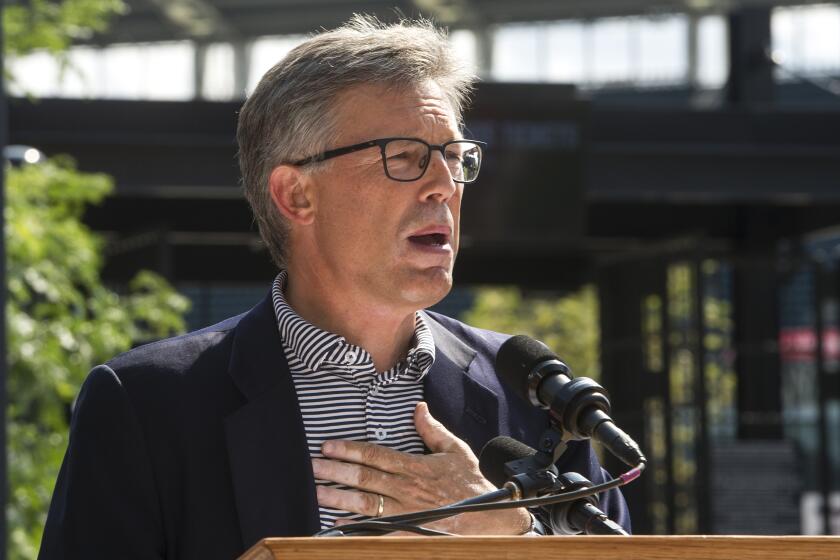 Cleveland Indians president Paul Dolan speaks at the unveiling of a statue honoring Indians Hall of Fame coach and player Lou Boudreau before a baseball game against the New York Yankees in Cleveland, Saturday, Aug. 5, 2017. (AP Photo/Phil Long)