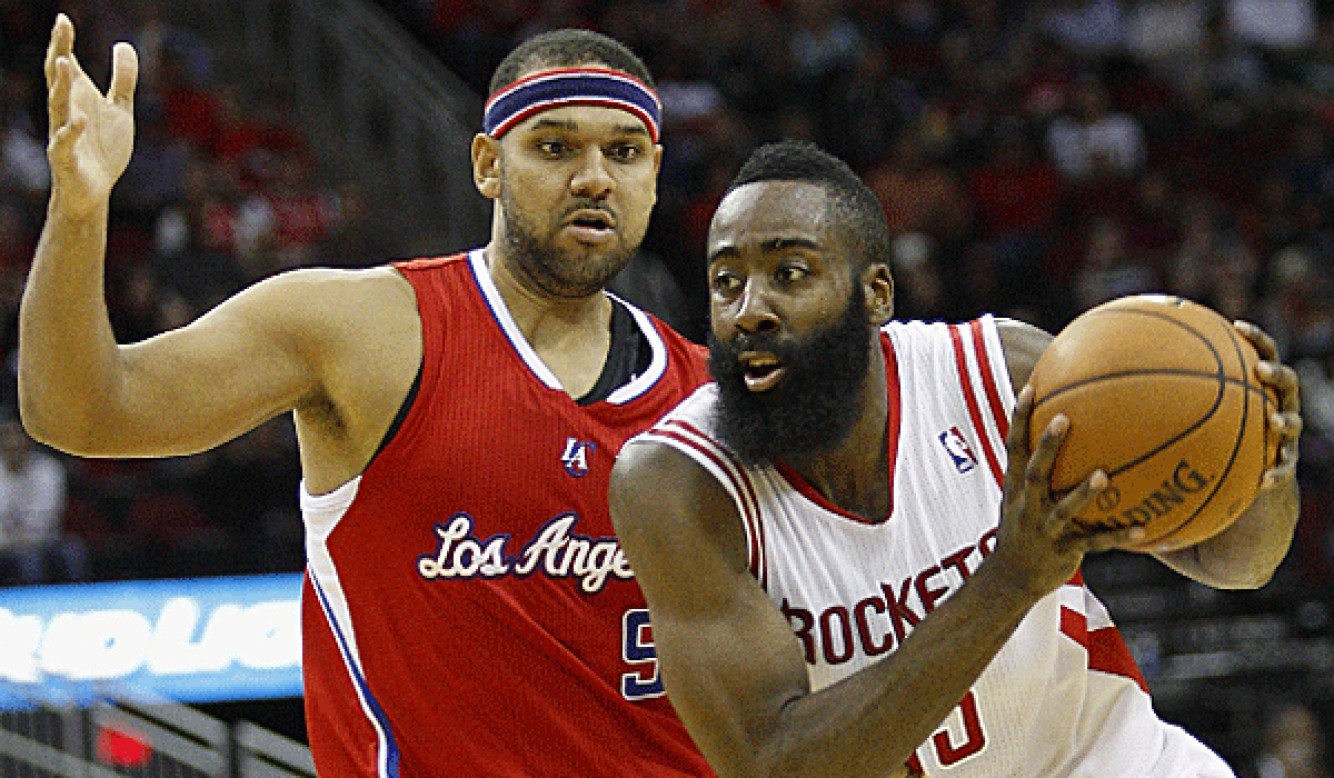 Clippers Jared Dudley, left, shown guarding Houston's James Harden on Saturday, said he had an MRI exam come back negative on his bruised right knee.