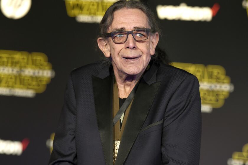 Peter Mayhew arrives at the world premiere of "Star Wars: The Force Awakens" in Los Angeles on Dec. 14, 2015. The towering actor, who played Chewbacca in the Star Wars films, died on April 30 at age 74. (Photo by Jordan Strauss/Invision/AP)